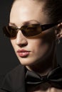 Portrait of Beautiful young woman in sunglasses with butterfly o Royalty Free Stock Photo