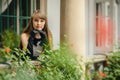 Portrait of beautiful young woman in white dress with black rose Royalty Free Stock Photo