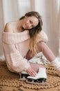 Portrait of beautiful young woman with white skates Royalty Free Stock Photo