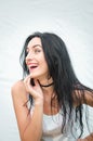 Portrait of a beautiful young woman in a white T-shirt with black hair. joy and laughter degenerate. positive emotions. Life style