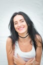 Portrait of a beautiful young woman in a white T-shirt with black hair. joy and laughter degenerate. positive emotions. Life style