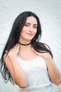 Portrait of a beautiful young woman in a white T-shirt with black hair. joy and laughter degenerate. positive emotions. Life style