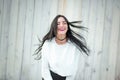 Portrait of a beautiful young woman in a white T-shirt with black hair. joy and laughter degenerate. positive emotions. Life style Royalty Free Stock Photo