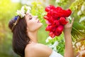 Portrait of a beautiful young woman in a wreath of spring flower