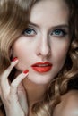 Portrait of beautiful young women with red lips