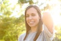 Portrait of a beauty adult woman posing in a park