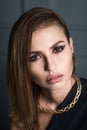 Portrait of the beauty. Beautiful, woman in a dress and jewelry, looking at the camera Royalty Free Stock Photo