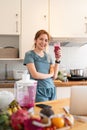 Portrait of beauty body slim healthy asian woman drinking glass of juice. young woman prepare cooking healthy drink in Royalty Free Stock Photo