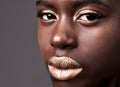 Portrait, beauty and closeup for cosmetic, black woman person and lipstick on grey background. Face, gold and eyeshadow