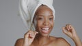 Portrait, beauty and dental floss with a happy black woman in studio on a gray background for natural wellness. Oral Royalty Free Stock Photo