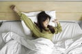 Portrait of beauty happy Asian woman awaking, wake up on the bed (sleep). Royalty Free Stock Photo