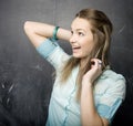 Portrait of beauty happy student with books near blackboard Royalty Free Stock Photo