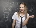 Portrait of beauty happy student with books near blackboard Royalty Free Stock Photo