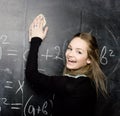 Portrait of beauty happy student with books near blackboard Royalty Free Stock Photo