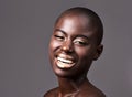 Portrait, beauty and makeup with bald black woman in studio on gray background for natural wellness. Face, smile and Royalty Free Stock Photo