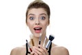 Portrait of beauty model with makeup and long eyelashes with cosmetic brush set in hand Royalty Free Stock Photo