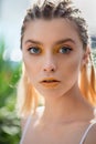 Portrait of beauty model with yellow creative makeup