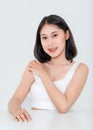 Portrait beauty shot, close up of millennial Asian short black hair model with makeup red lip in tank top undershirt sitting at Royalty Free Stock Photo