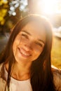 Portrait of beauty woman Enjoying Nature Outdoors. Beautiful autumn model with long hair. Sunlight at sunset. Warm toned artwork. Royalty Free Stock Photo