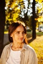 Portrait of beauty woman Enjoying Nature Outdoors. Beautiful autumn model with long hair. Sunlight at sunset. Warm toned artwork. Royalty Free Stock Photo