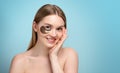 Portrait of Beauty woman with eye patches showing an effect of perfect skin. Beautiful face of young adult woman with clean fresh Royalty Free Stock Photo