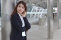 Portrait of beauty young Asian businesswoman in suit standing and looking at far away. Thinking and thoughtful business concept Royalty Free Stock Photo