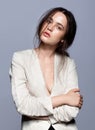 Portrait of beauty young brunette woman portrait in white fashion female jacket Royalty Free Stock Photo