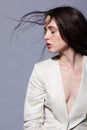 Portrait of beauty young brunette woman portrait in white fashion female jacket Royalty Free Stock Photo