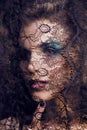 portrait of beauty young woman through lace close up mistery mak Royalty Free Stock Photo