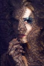 portrait of beauty young woman through lace close up mistery mak Royalty Free Stock Photo