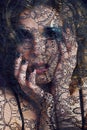 portrait of beauty young woman through lace close up mistery mak Royalty Free Stock Photo