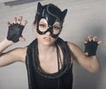 Portrait Of Beauty Young Woman In Mask Like Cat In White Box