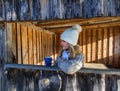 Portrait of beauty young woman in wood building and blue cup of tea Royalty Free Stock Photo