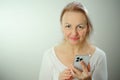 portrait of beautyful woman on the phone looks in camera Happy checking social media holding smartphone at home woman Royalty Free Stock Photo