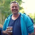 Portrait, beer and man at outdoor party, celebration or happy adventure at holiday event in Germany. Smile, drinks and Royalty Free Stock Photo