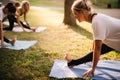 Portrait of beuatiful girl doing yoga in city park on summer sunny morning