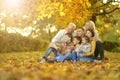 Big family having fun together in autumnal park Royalty Free Stock Photo