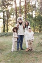 Portrait of big family outdoors. Young Stylish bearded dad with little son on shoulder, beautiful brunette mom, child Royalty Free Stock Photo