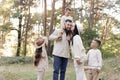 Portrait of big family outdoors. Young Stylish bearded dad with little son on shoulder, beautiful brunette mom, child Royalty Free Stock Photo