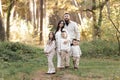 Portrait of big family outdoors. Young Stylish bearded dad with little son on shoulder, beautiful brunette mom, child Royalty Free Stock Photo