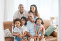 Portrait, big family and smile in home on sofa, bonding or having fun in living room. Grandparents, parents and Royalty Free Stock Photo