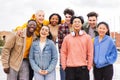 Portrait of big group of teenage multiracial young friends smiling and looking at camera. Front view of a lot of happy Royalty Free Stock Photo