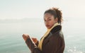 Portrait of biracial girl near water