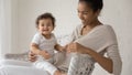 Portrait of biracial mom play with baby child Royalty Free Stock Photo