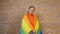 Portrait Of Black African American Woman Celebrating With A LGBT Flag  Gay Or Lesbian Flag Or Rainbow Flag. Pride Symbol. People