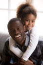 Black father and little daughter embracing indoors Royalty Free Stock Photo