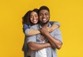 Portrait of black couple in love hugging and smiling at camera Royalty Free Stock Photo