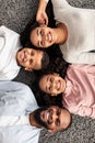 Portrait of black family lying on floor together Royalty Free Stock Photo