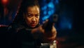 Portrait of black female police officer aiming gun at criminal, orders to drop the weapon and stop Royalty Free Stock Photo