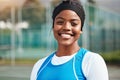 Portrait, black girl with netball and sport with smile, fitness and training for game outdoor, happy teen and ready